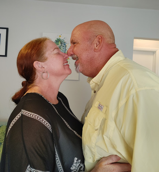 Newlywed couple at an intimate home wedding ceremony officiated by Christine Countywide Mobile Notary